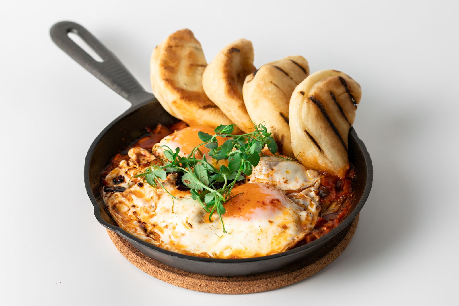 Vegetarian Shakshu-huh? in a cast-iron pan with house bread